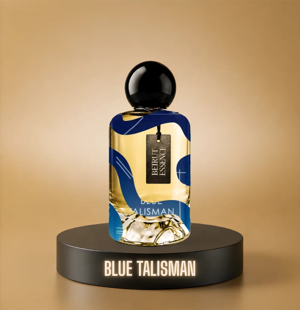 BeirutEssence fragrance inspired by Blue Talisman, photographed on a dark pedestal with a warm gold background