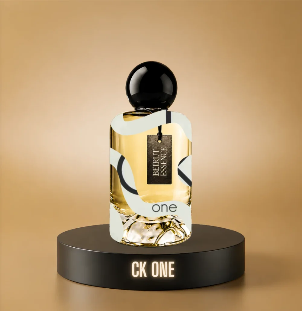 BeirutEssence fragrance inspired by CK One, photographed on a dark pedestal with a warm gold background