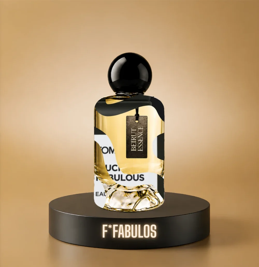 BeirutEssence fragrance inspired by Fabulous, photographed on a dark pedestal with a warm gold background