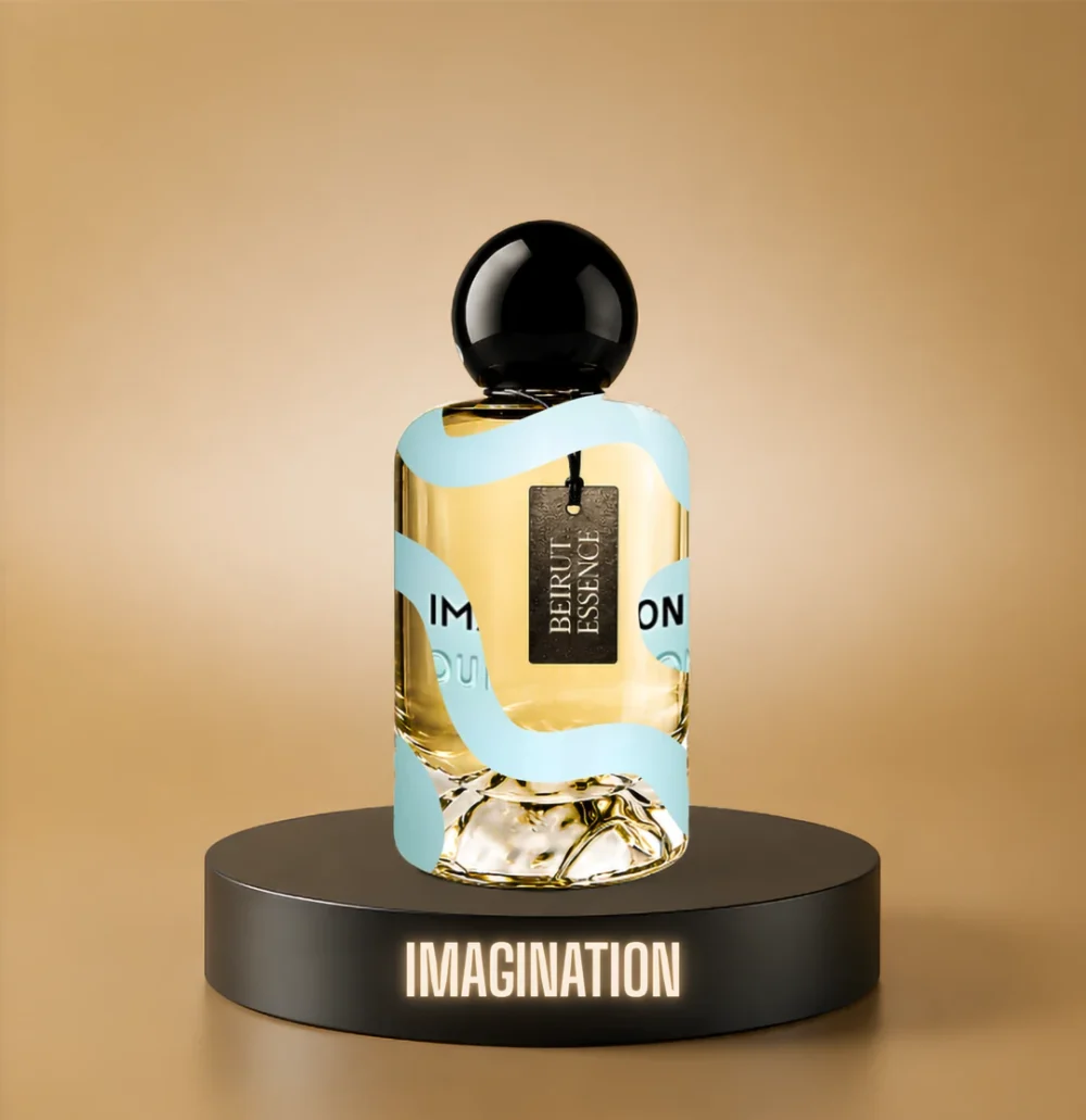 BeirutEssence fragrance inspired by Imagination, photographed on a dark pedestal with a warm gold background