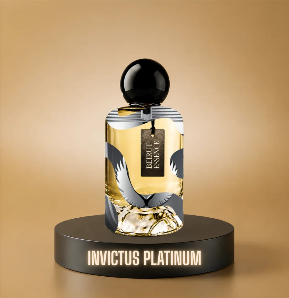 BeirutEssence fragrance inspired by Invictus Platinum, photographed on a dark pedestal with a warm gold background