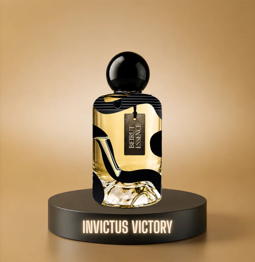 BeirutEssence fragrance inspired by Invictus Victory, photographed on a dark pedestal with a warm gold background