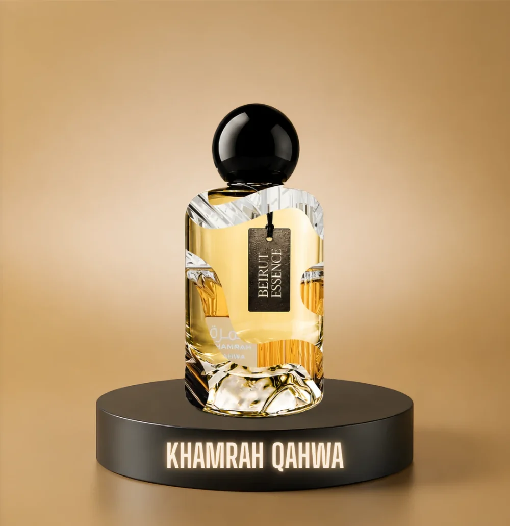 BeirutEssence fragrance inspired by Khamrah Qahwa, photographed on a dark pedestal with a warm gold background