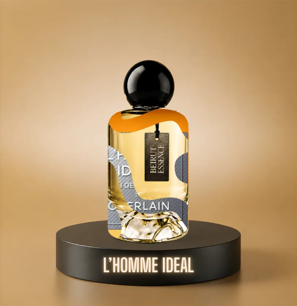 BeirutEssence fragrance inspired by L'Homme Idéal, photographed on a dark pedestal with a warm gold background