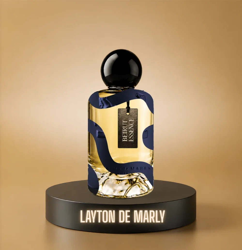 BeirutEssence fragrance inspired by Layton, photographed on a dark pedestal with a warm gold background