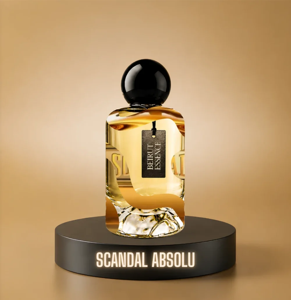BeirutEssence fragrance inspired by Scandal Absolu, photographed on a dark pedestal with a warm gold background