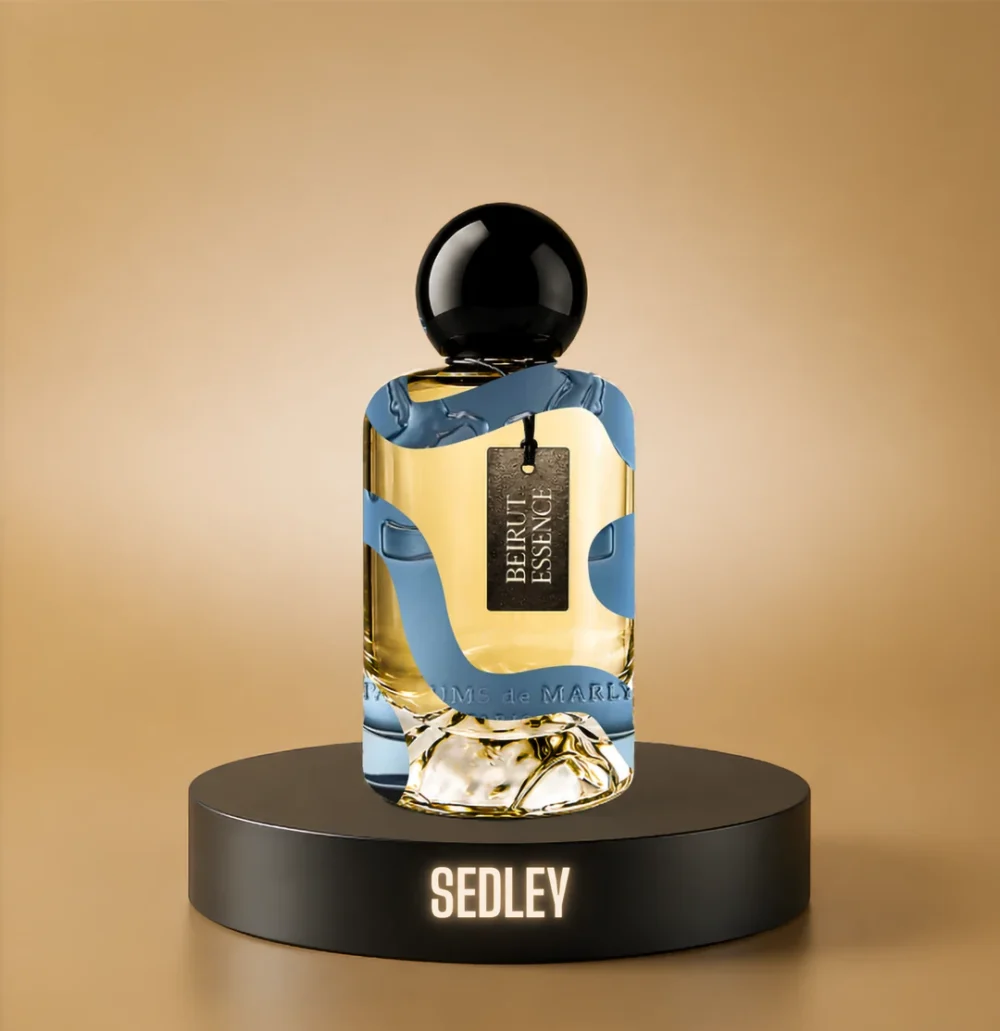 BeirutEssence fragrance inspired by Sedley, photographed on a dark pedestal with a warm gold background
