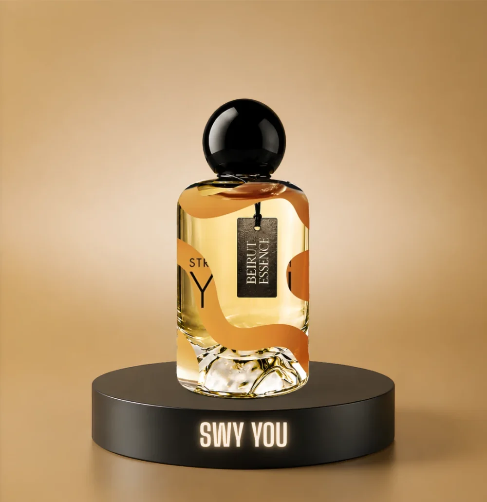 BeirutEssence fragrance inspired by Stronger With You, photographed on a dark pedestal with a warm gold background