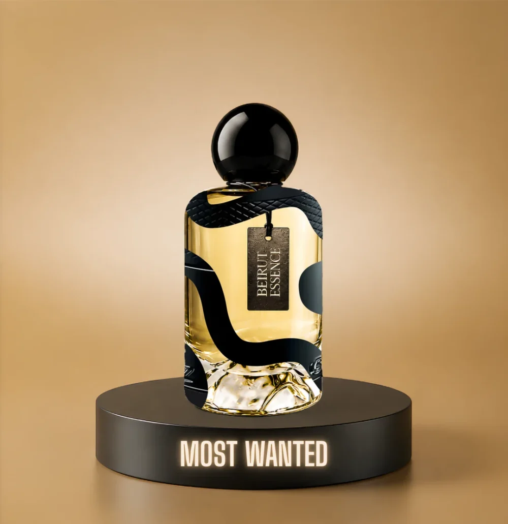 BeirutEssence fragrance inspired by The Most Wanted, photographed on a dark pedestal with a warm gold background