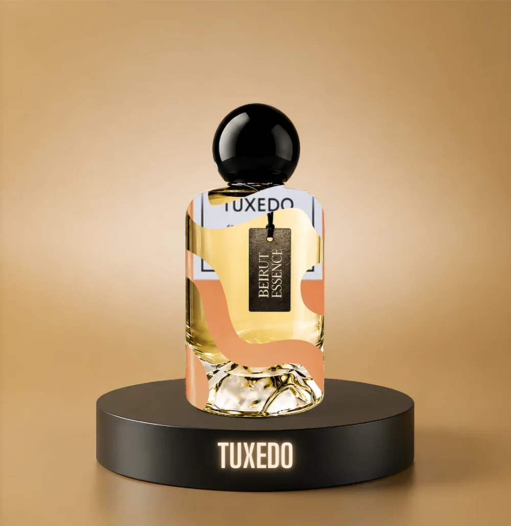 BeirutEssence fragrance inspired by Tuxedo, photographed on a dark pedestal with a warm gold background